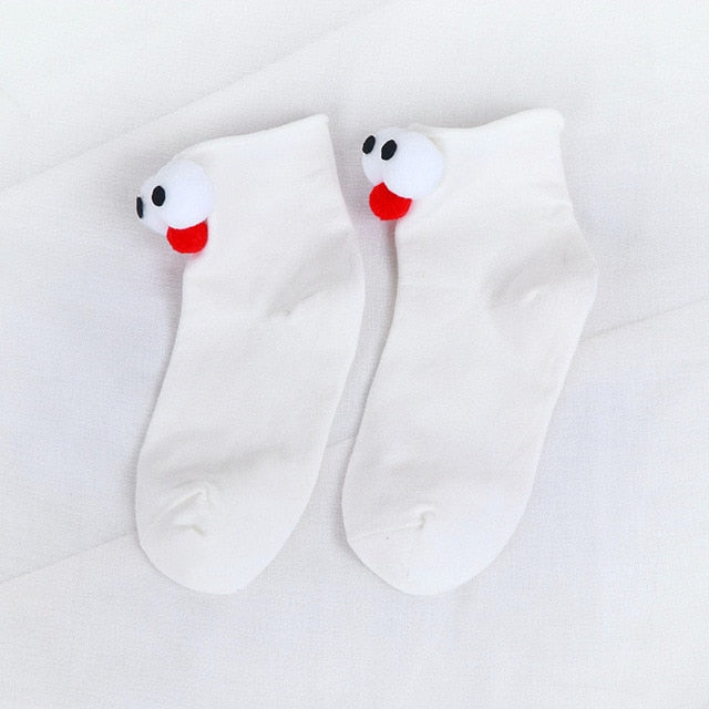 Womens white cartoon socks with eyes and nose.