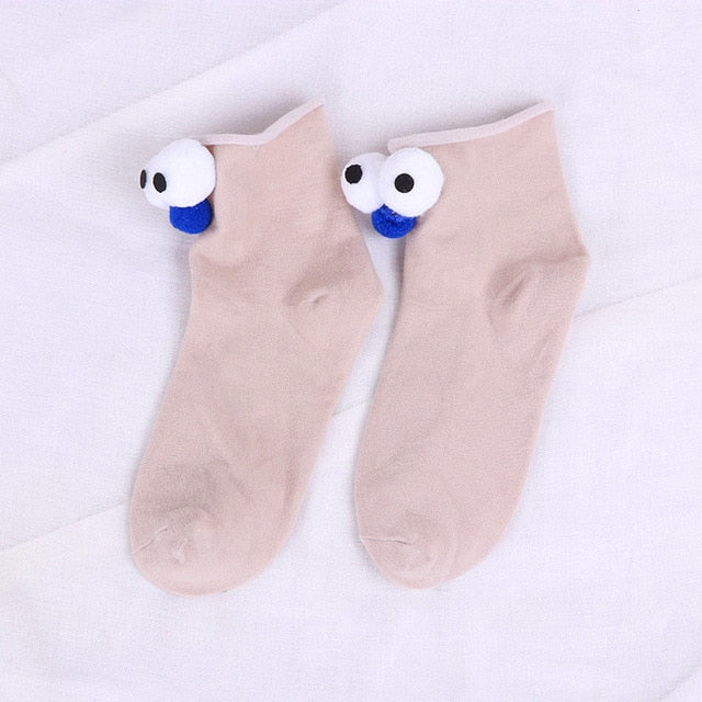 Womens colorful cartoon socks with eyes and nose.