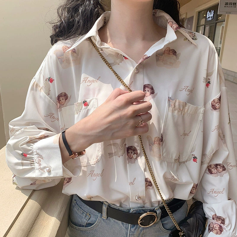 Women's creme color button-up blouse with angels and doves print.