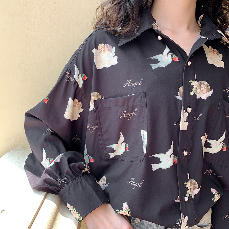 Women's black color button up blouse with angels and doves print.