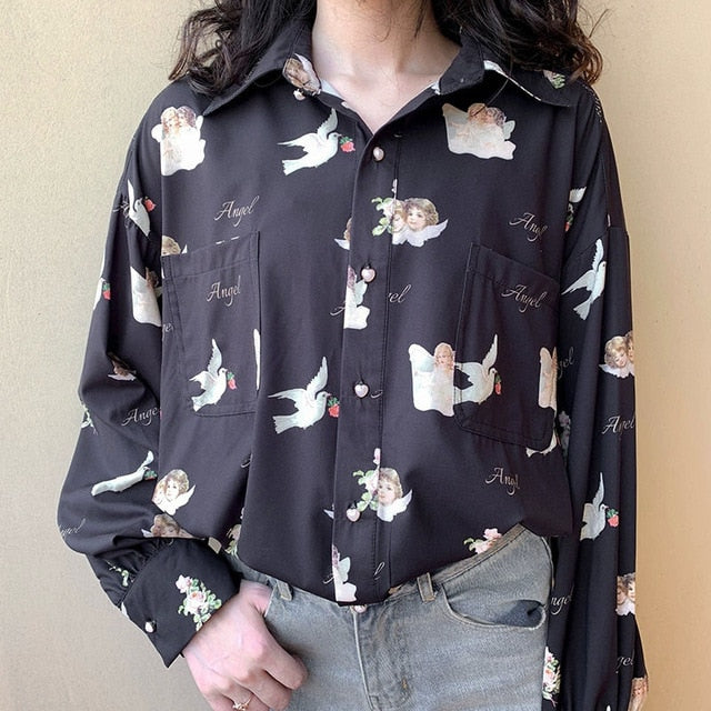 Women's button up blouse with angels and doves print.
